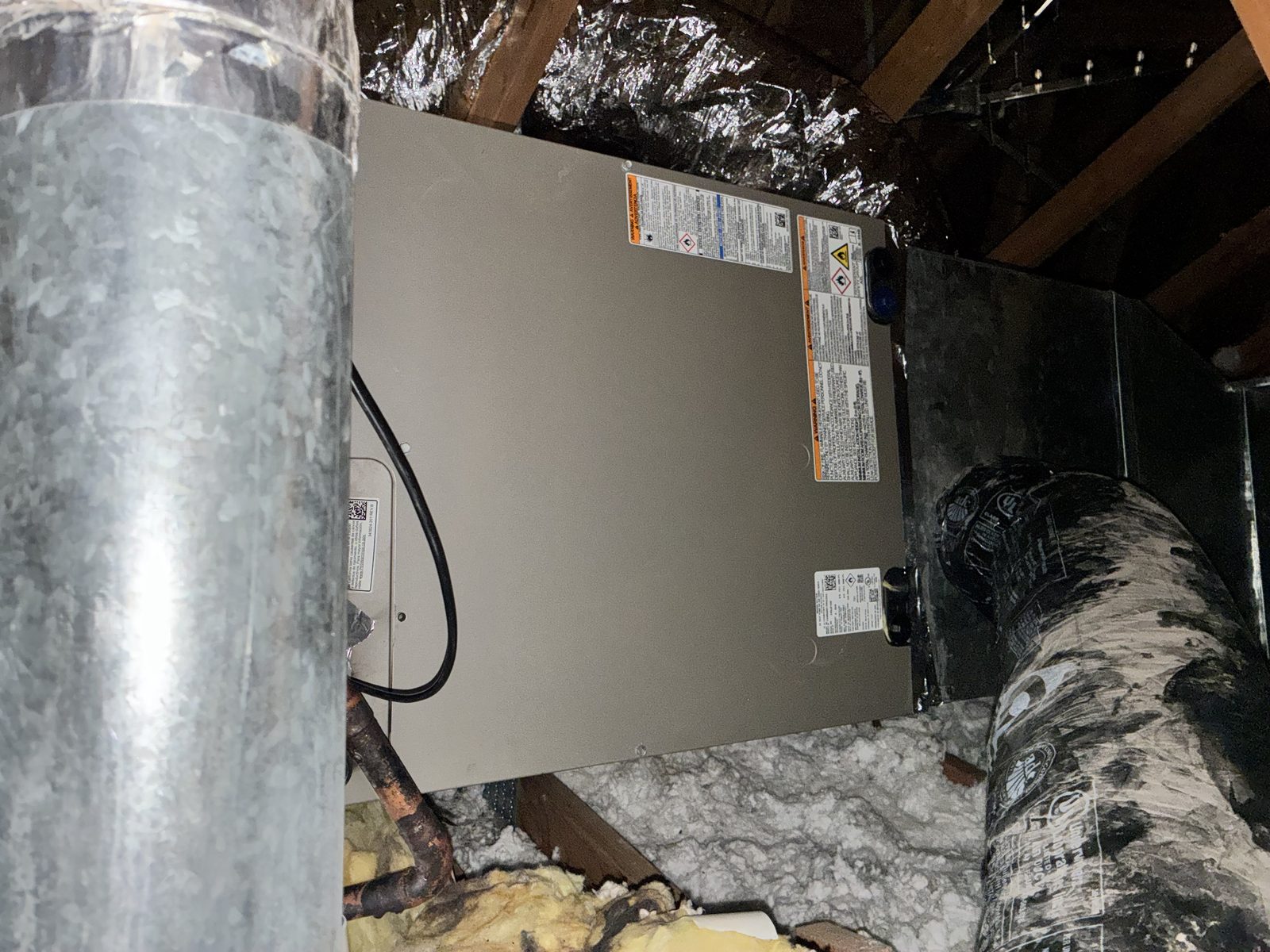Attic-mounted air handler with insulated ducting installed by Cluff HVAC in a Washington County home