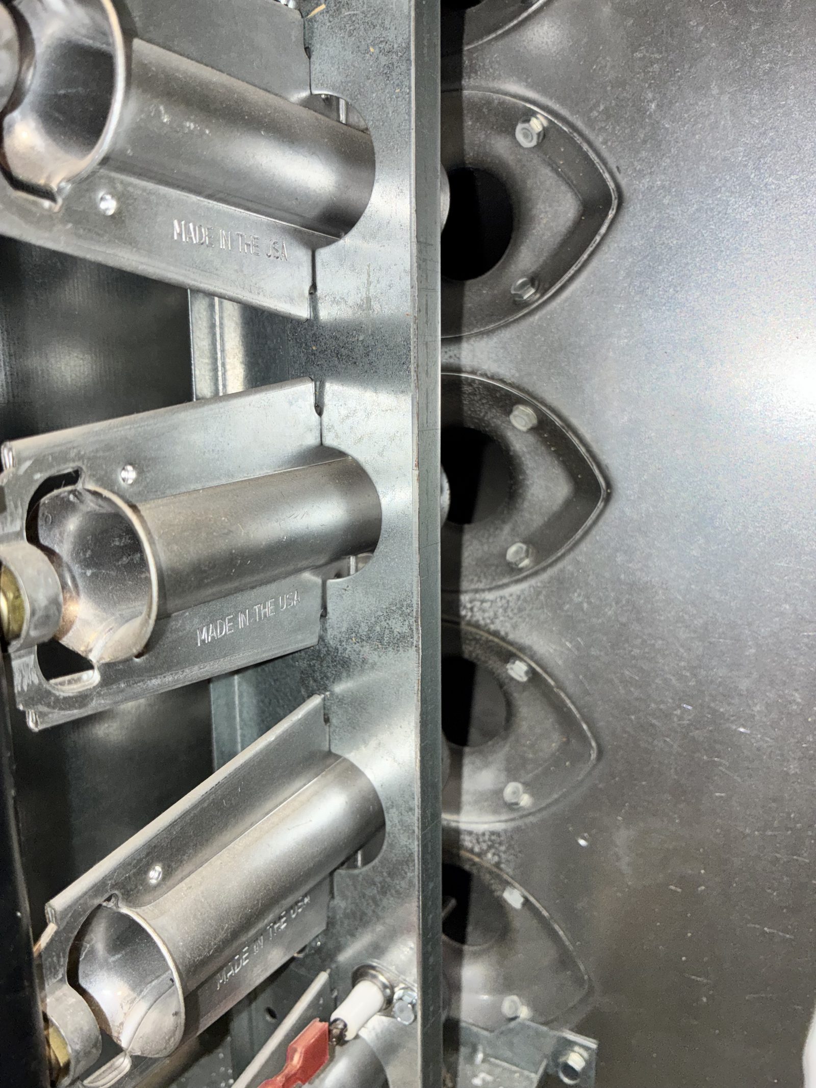 Furnace burner assembly and heat exchanger inspected during a fall heating tune-up